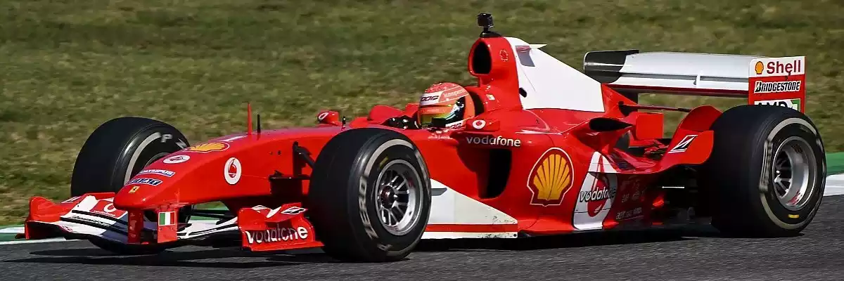 A Ferrari F2004 with plain white panels in place of tobacco branding.